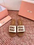Miu Miu Canvas and leather slides